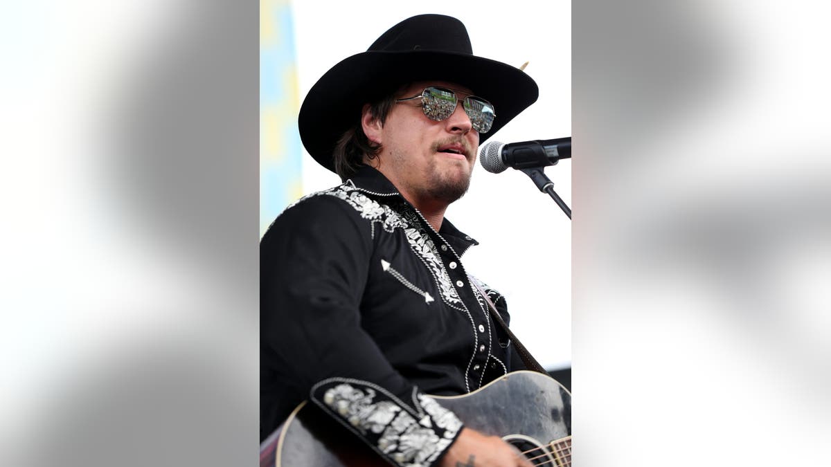 Gavin Adcock performing on the Chevy Riverfront stage at CMA Fest in Nashville