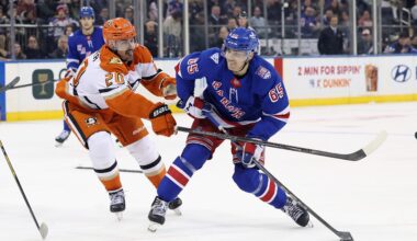 Chris Kreider #20 of the Anaheim Ducks checks Brett Berard #65 of the New York Rangers