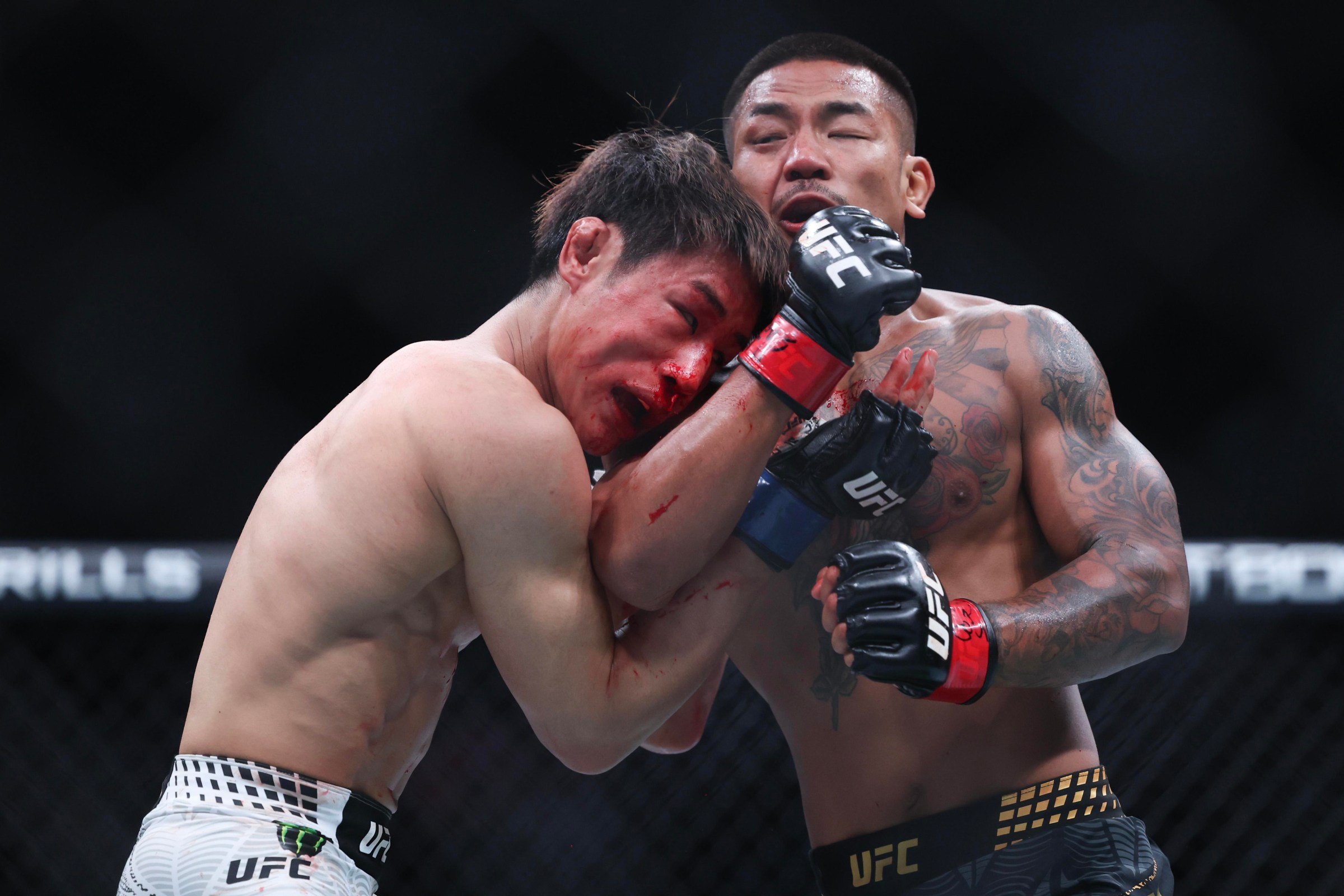 NEWARK, NEW JERSEY - MAY 09: Joshua Van of Myannmar, (R), strikes Tatsuro Taira of Japan in a flyweight title bout during UFC 328 at the Prudential Center on May 09, 2026 in Newark, New Jersey. (Photo by Ishika Samant/Getty Images)