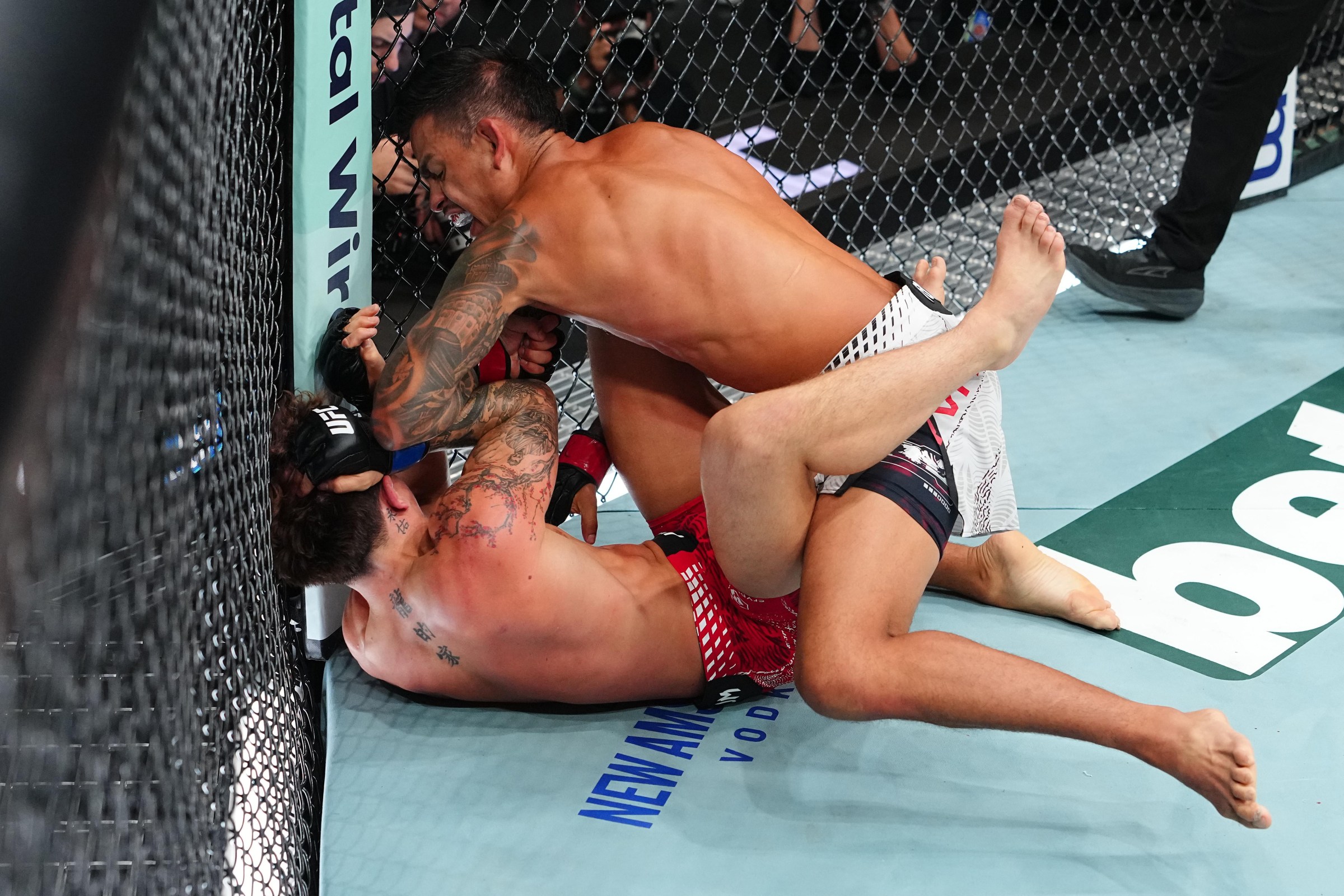 LAS VEGAS, NEVADA - JULY 11: (R-L) Brandon Royval strikes Lone’er Kavanagh of England in a flyweight fight during the UFC 329 event at T-Mobile Arena on July 11, 2026 in Las Vegas, Nevada. (Photo by Jeff Bottari/Zuffa LLC)