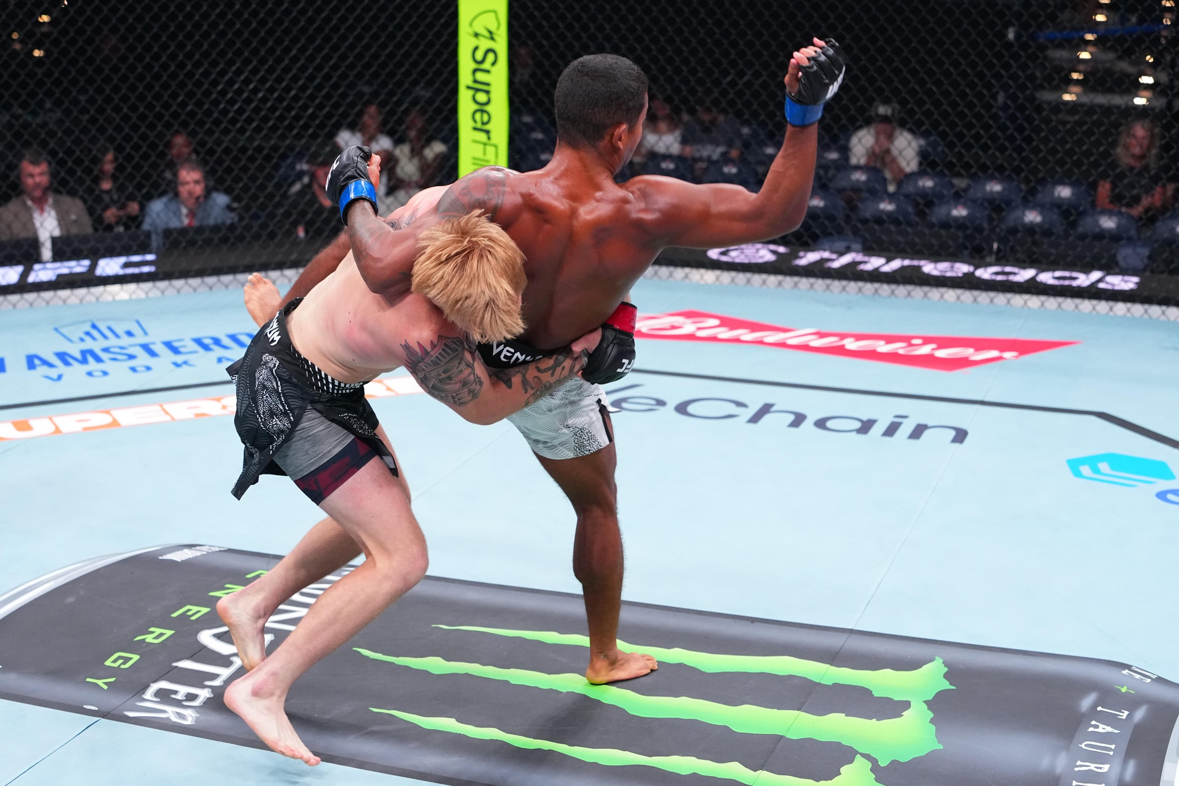 OKLAHOMA CITY, OKLAHOMA - JULY 18: (L-R) Ezra Elliott takes down Damien Anderson in a featherweight fight during the UFC Fight Night event at Paycom Center on July 18, 2026 in Oklahoma City, Oklahoma. (Photo by Jeff Bottari/Zuffa LLC)