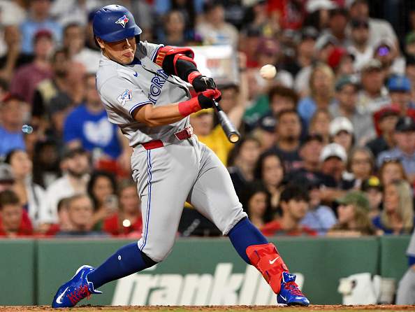 BOSTON, MASSACHUSETTS - JULY 24: Kazuma Okamoto #7 of the Toronto Blue Jays hits a double against the Boston Red Sox during the fifth inning at Fenway Park on July 24, 2026 in Boston, Massachusetts. (Photo by Brian Fluharty/Getty Images)
