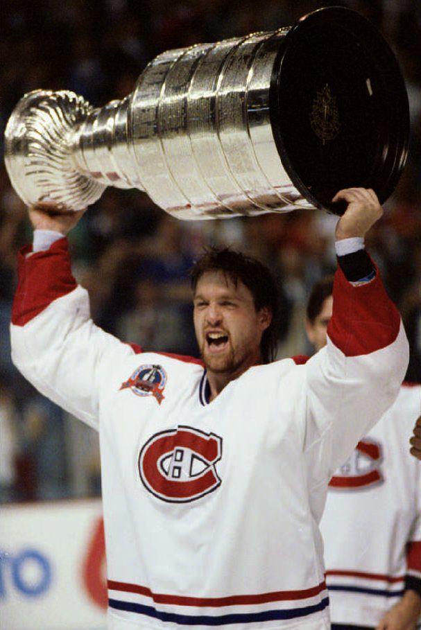 MONTREAL, CANADA – JUNE 9: Stanley Cup Most Valuable Player Patrick Roy of the Montreal Canadiens holds the cup over his head after Montreal defeated the Los Angeles Kings 4-1 09 June 1993. (Photo credit should read MONTREAL GAZETTE/AFP via Getty Images)
