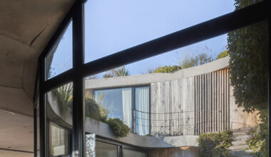 rooftop garden crowns concrete house shaped by spiraling patios