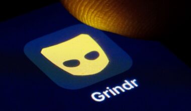 The Grindr app logo on a phone