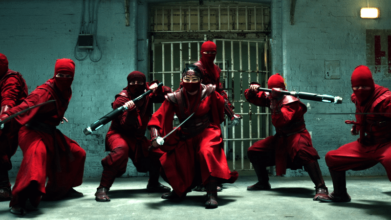 The Hand holding swords in a jail cell in 'Spider-Man: Brand New Day.'