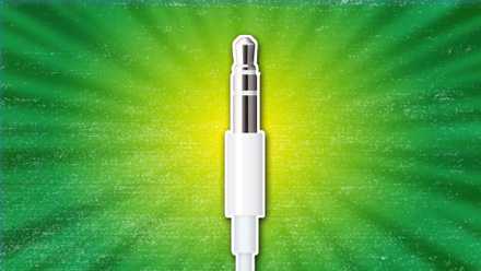 Image of a headphone jack against a green background