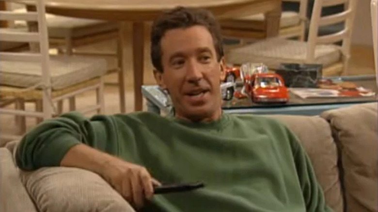 Tim watching TV and speaking