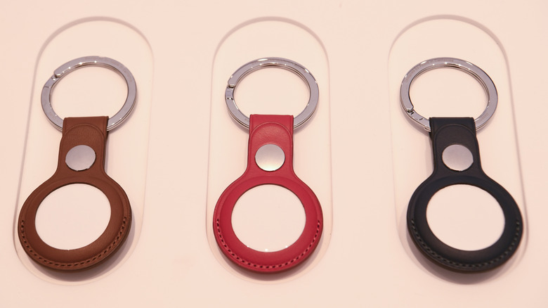 A bunch of key rings for AirTag on display in an Apple Store