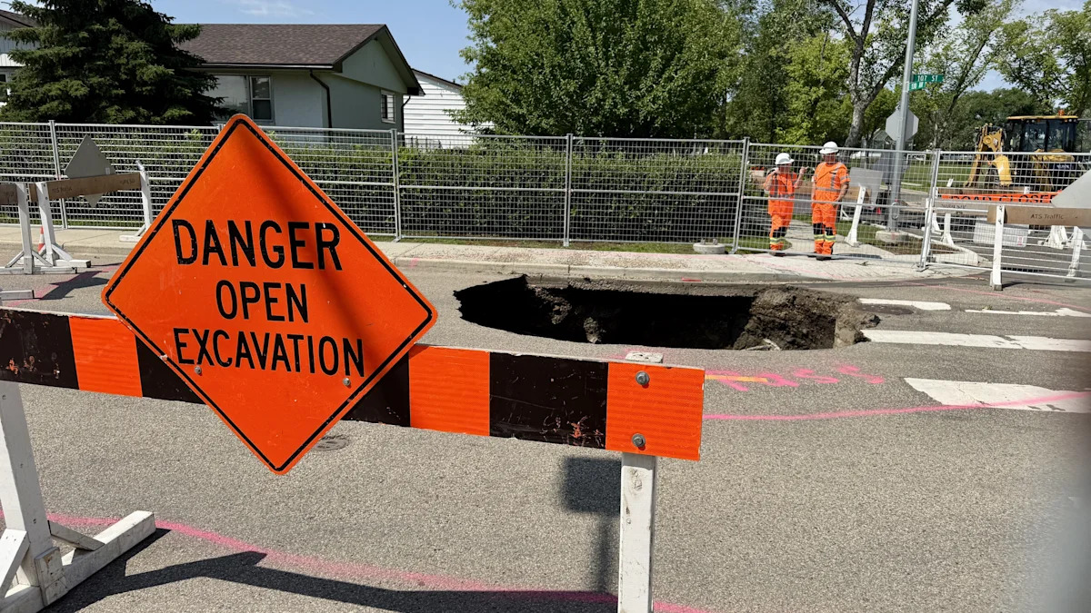 Deep sinkhole opens up in north Edmonton after weekend thunderstorms