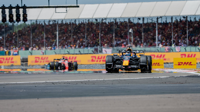 Max Verstappen of the Netherlands driving the (3) Oracle Red Bull Racing RB22 Red Bull Ford leads Charles Leclerc of Monaco driving the (16) Scuderia Ferrari SF-26 on track during the Sprint ahead of the F1 Grand Prix of Great Britain at Silverstone Circuit on July 04, 2026 in Northampton, England.