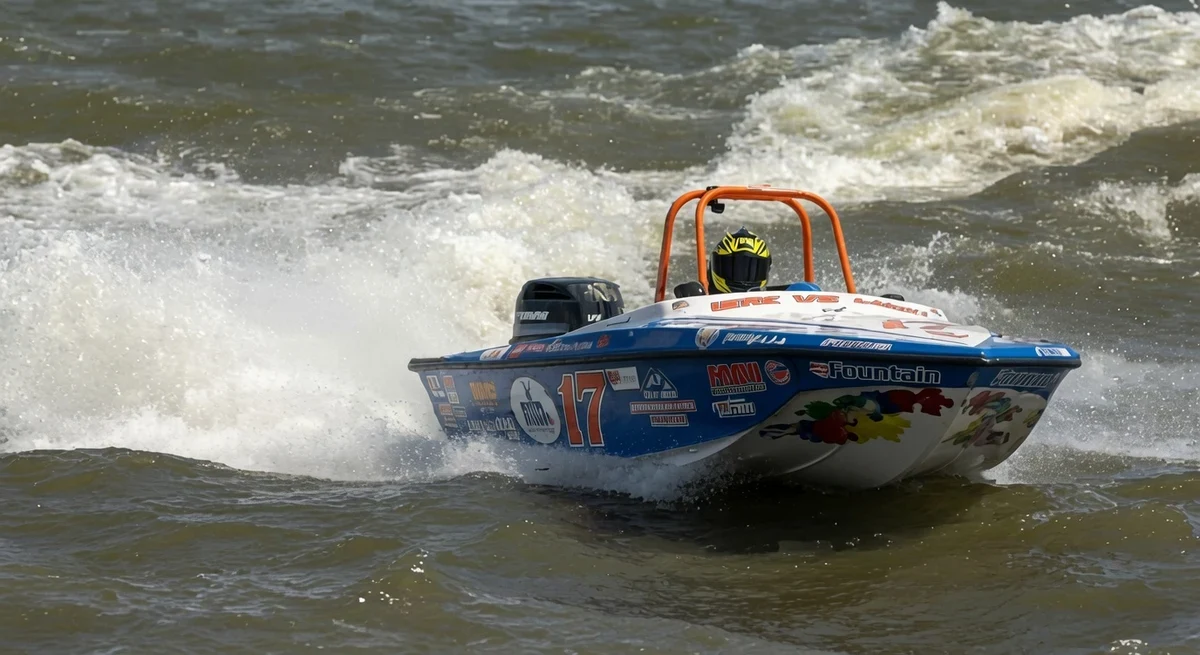 Neal Marsh driving his Tri Hull boat through rough water on the Mississippi River during Saturday qualifying at the 2026 Alton Powerboat Nationals