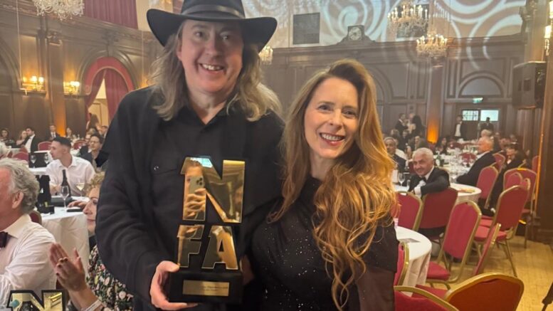 ‘Becoming Led Zeppelin’ director Bernard MacMahon (left) and producer Allison McGourty (right) at the UK’s National Film Awards in London on July 1, 2026. ‘Becoming Led Zeppelin’ won an award for best documentary / docu-series (Courtesy of Bernard MacMahon)