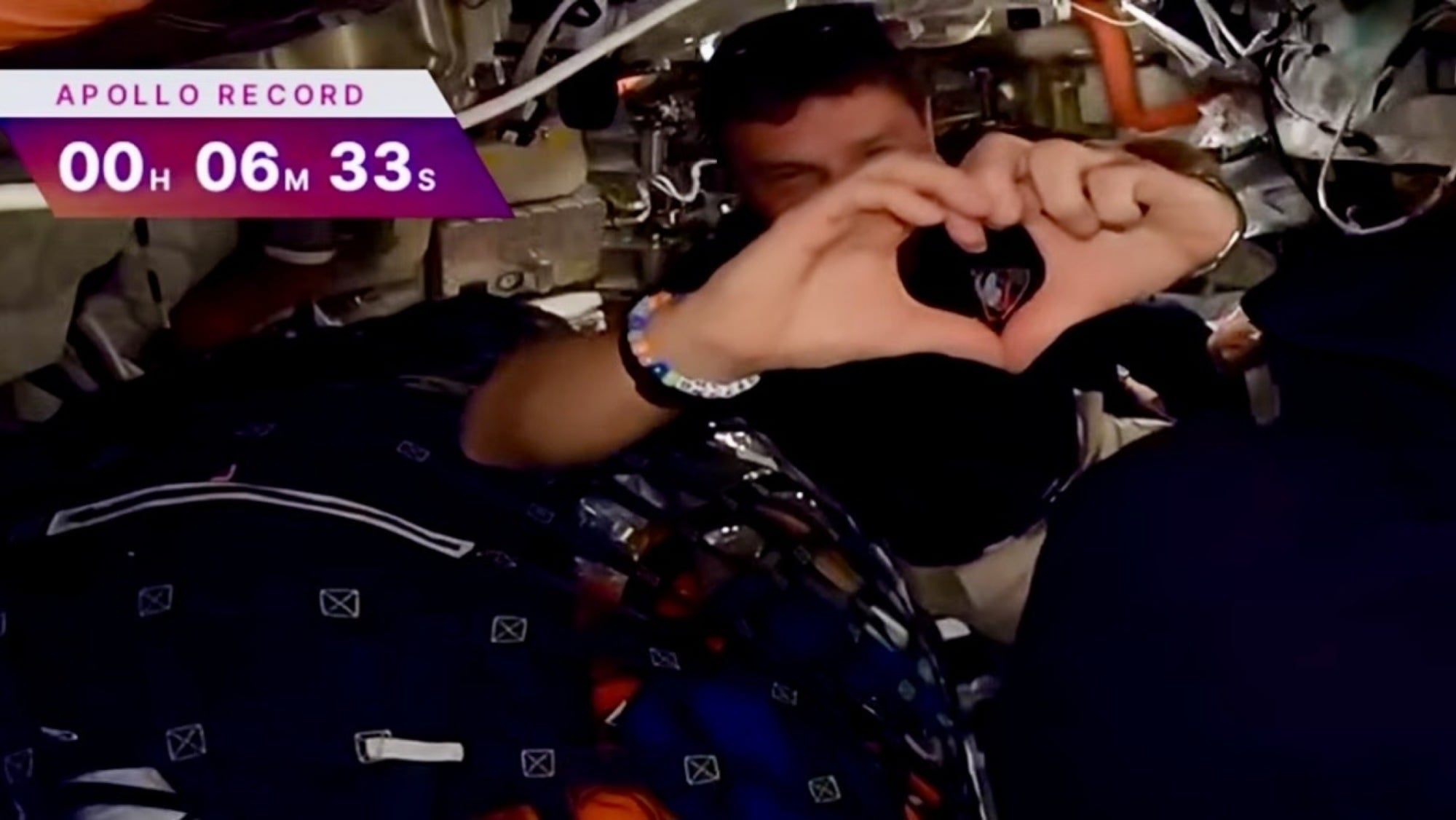 Reid Wiseman sending a heart to his family over video livestream
