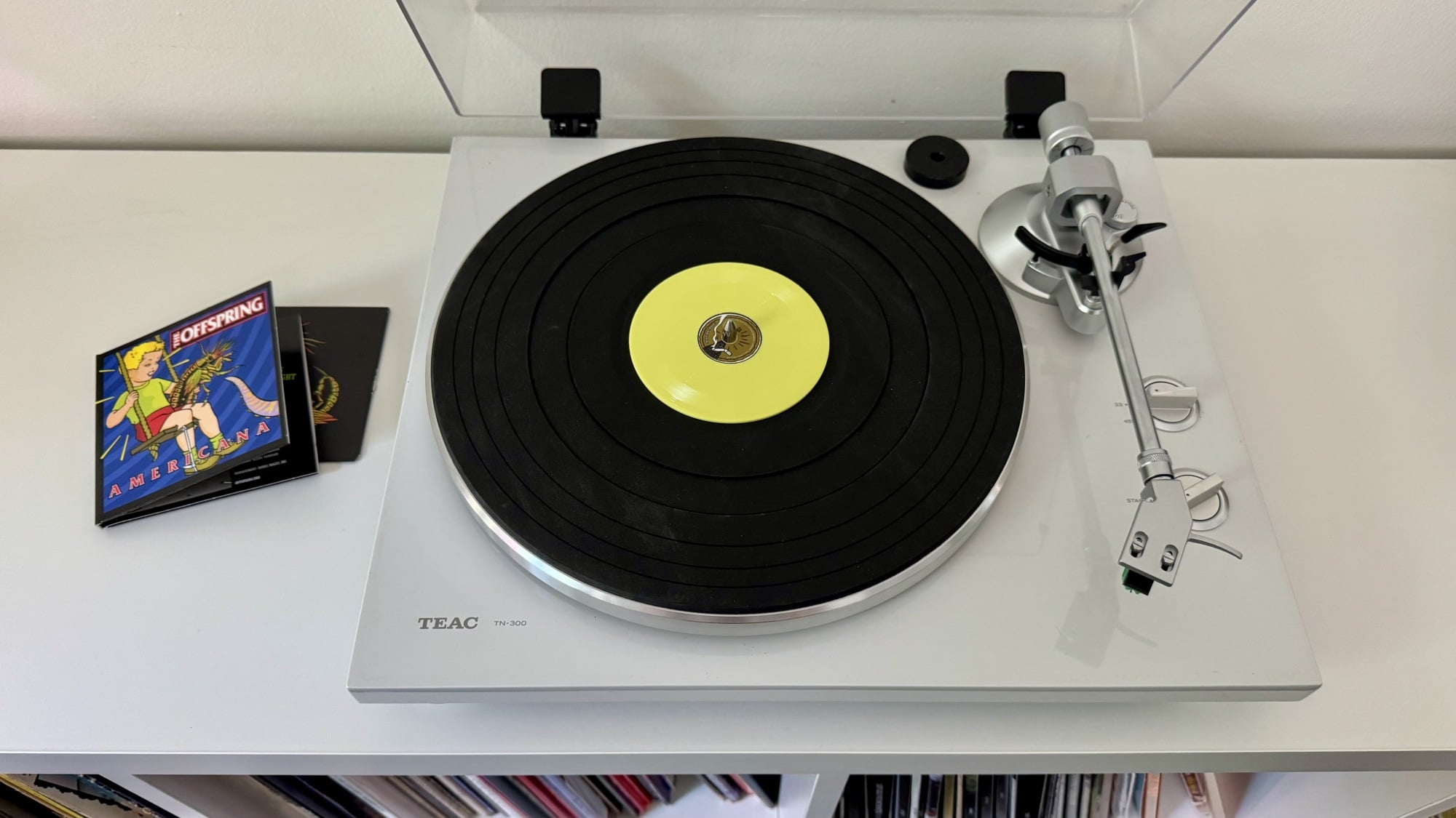 a tiny vinyl record on a standard turntable