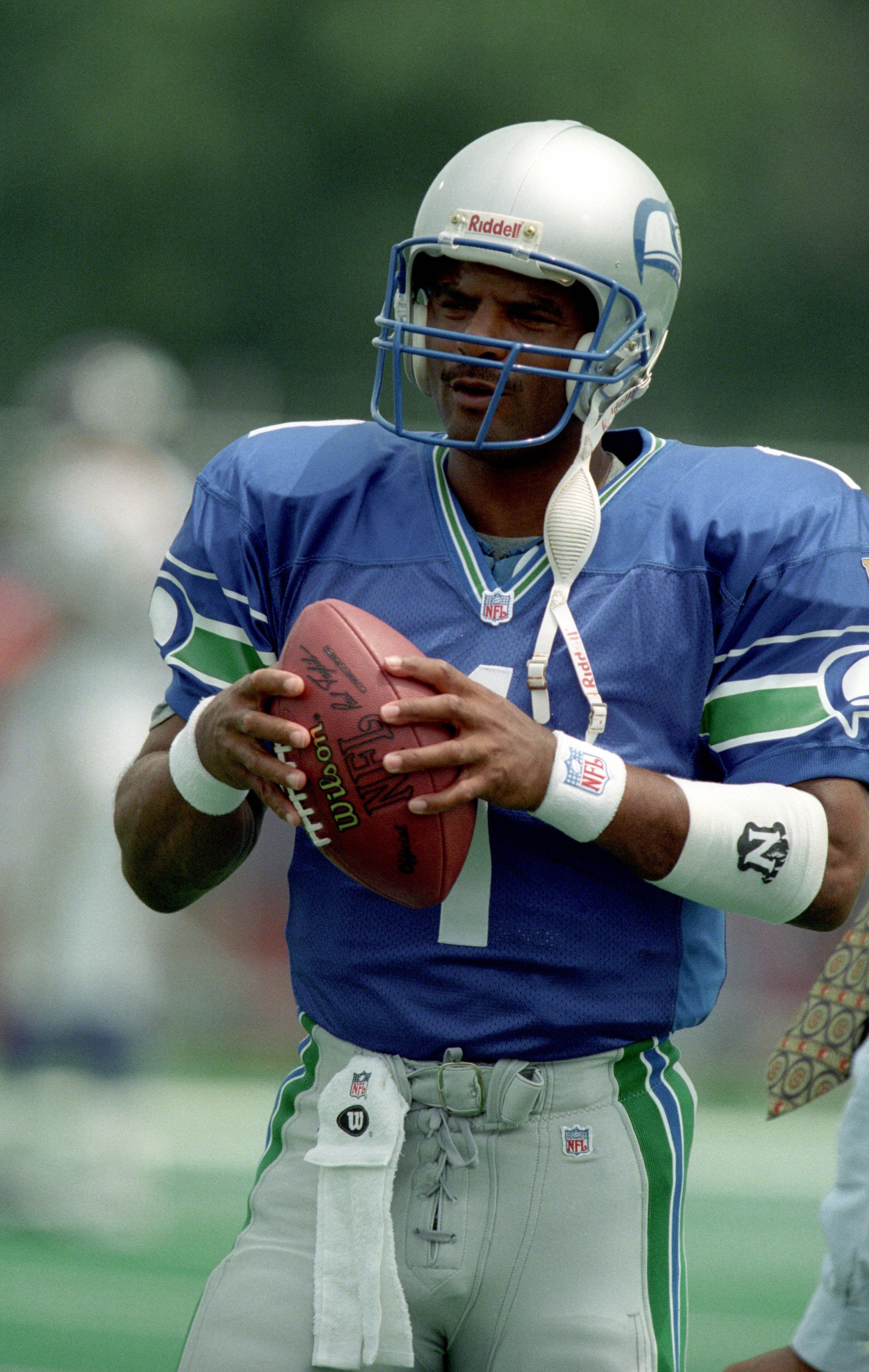 Jul 26, 1997; Canton, OH, USA; Seattle Seahawks quarterback Warren Moon (1) prior to the game against the Minnesota Vikings at Fawcett Stadium for the Hall of Fame game. The Vikings beat the Seahawks 28-26. Mandatory Credit: Matthew Emmons-Imagn Images