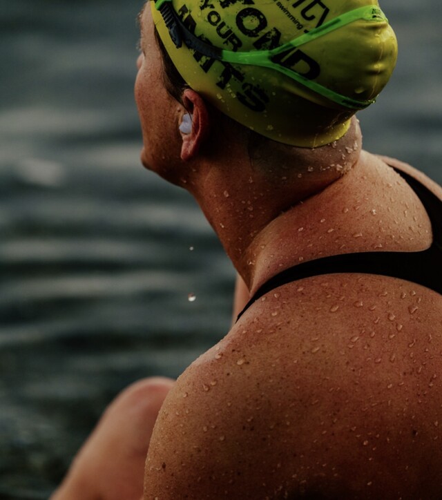 Vancouver swimmer Jessi Harewicz ended her attempt to complete Canada's longest unassisted, non-stop swim in Okanagan Lake after covering 30 kilometres over 17 hours on Friday.