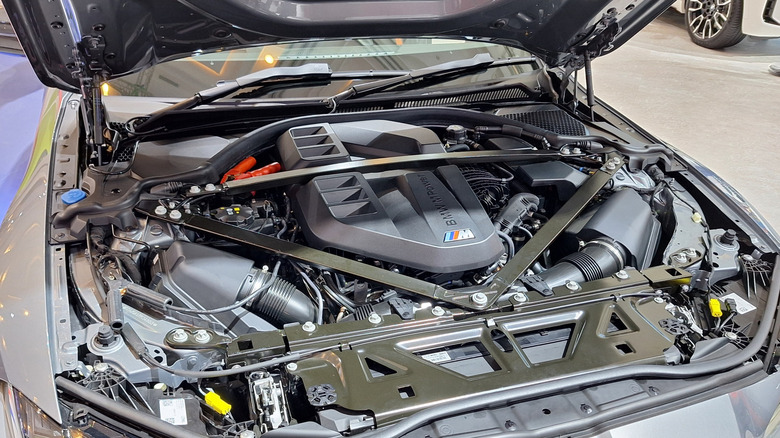 The engine room of BMW M4 Series showing the BMW B58 Twin Turbo inline six engine