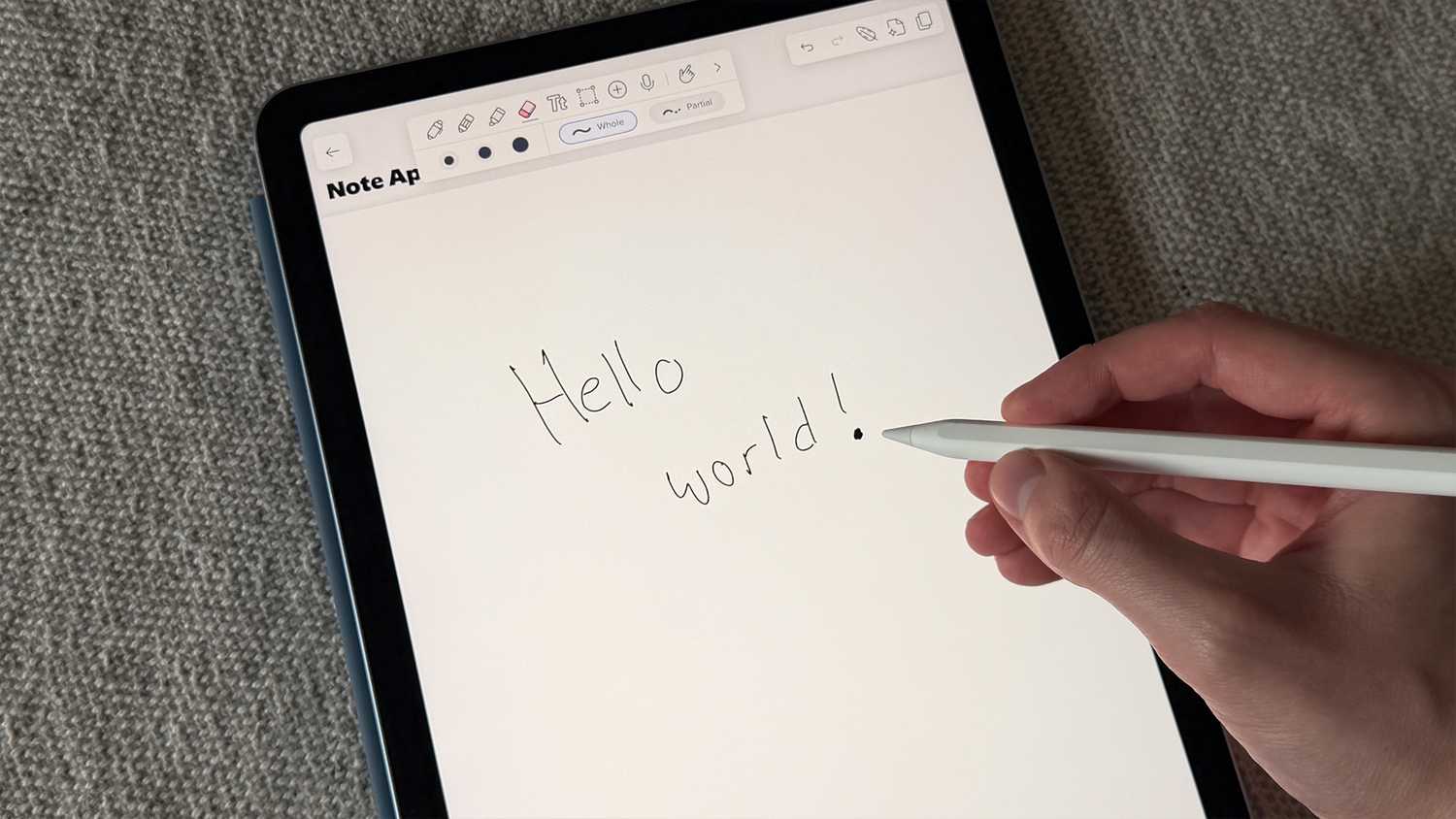 Handwriting a note on an M4 iPad Air.