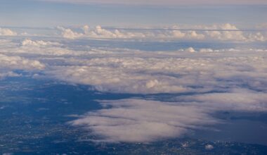 Astronauts who have seen the whole Earth at once describe the overview effect — every war and border and argument hanging in silence — and afterwards traffic and small talk can feel strangely far away, like the world seen through glass