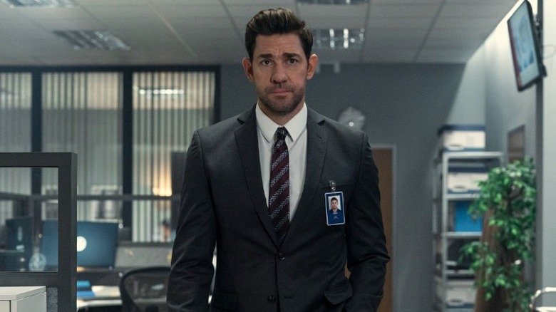 Jack Ryan wearing a suit while walking through the office in Jack Ryan Season 4