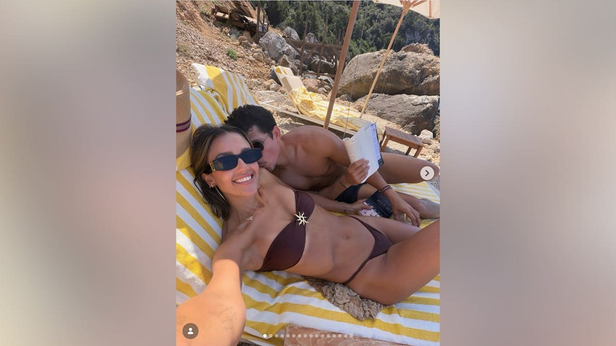 Jessica Alba and Danny Ramirez on the beach in Italy in July 2026.