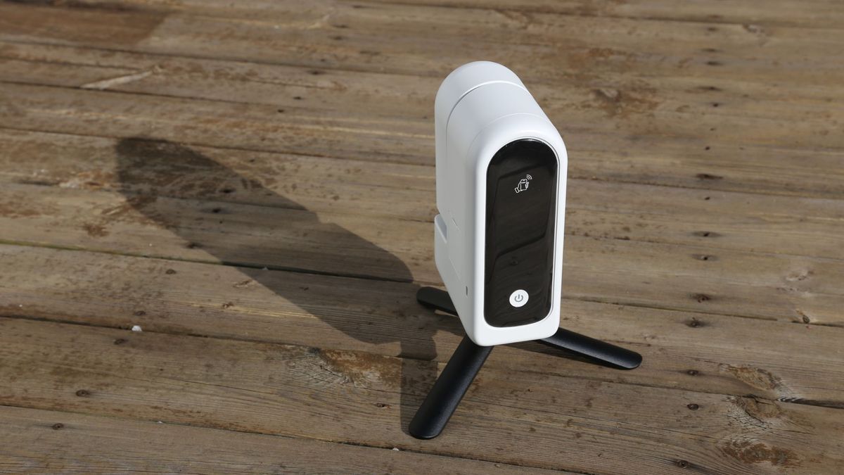The ZWO Seestar S30 Pro mounted on a tripod on a wooden table.