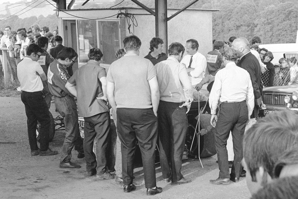 Rindt and the Lotus team managing to squeeze their 
car through scrutineering provided entertainment for onlookers 