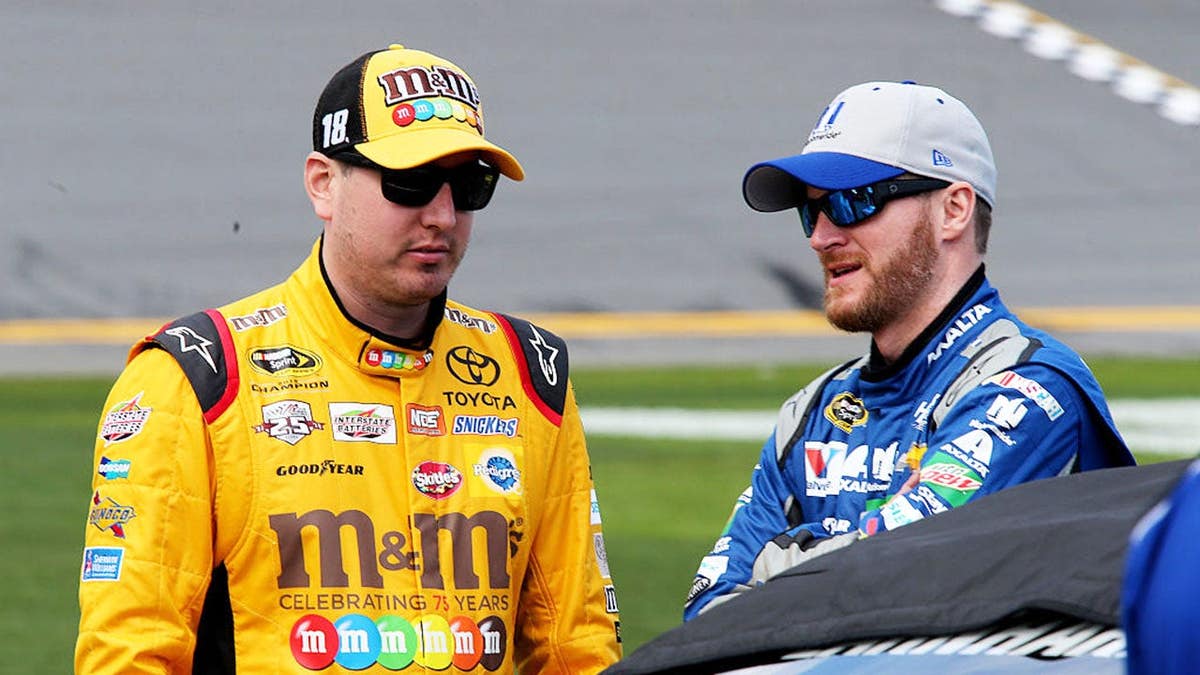 Kyle Busch and Dale Earnhardt Jr. talking on the grid at Daytona International Speedway