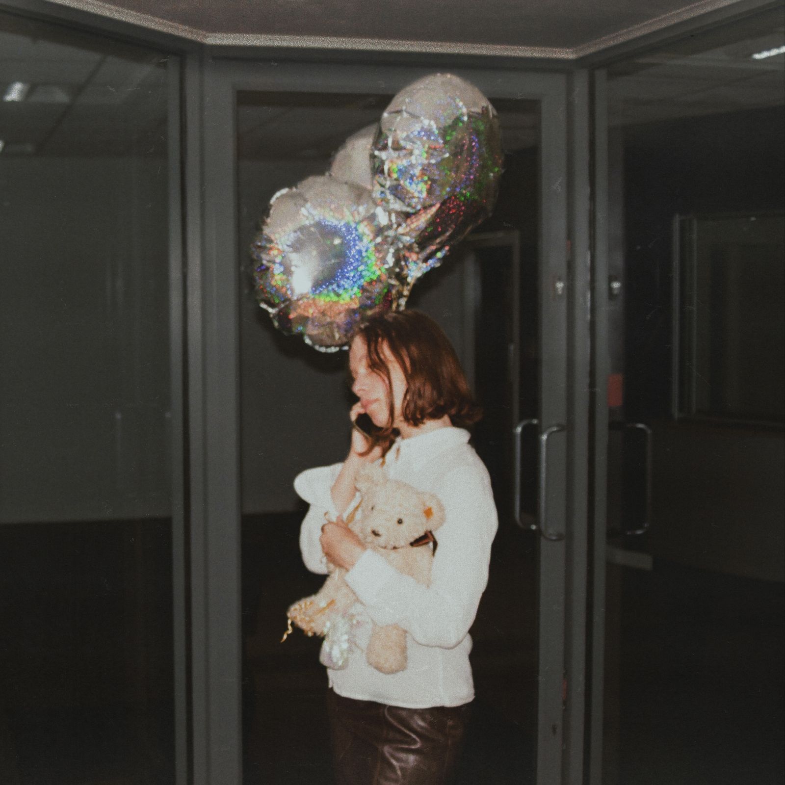 Image may contain Face Head Person Photography Portrait Door Balloon People Teddy Bear Toy Clothing and Pants