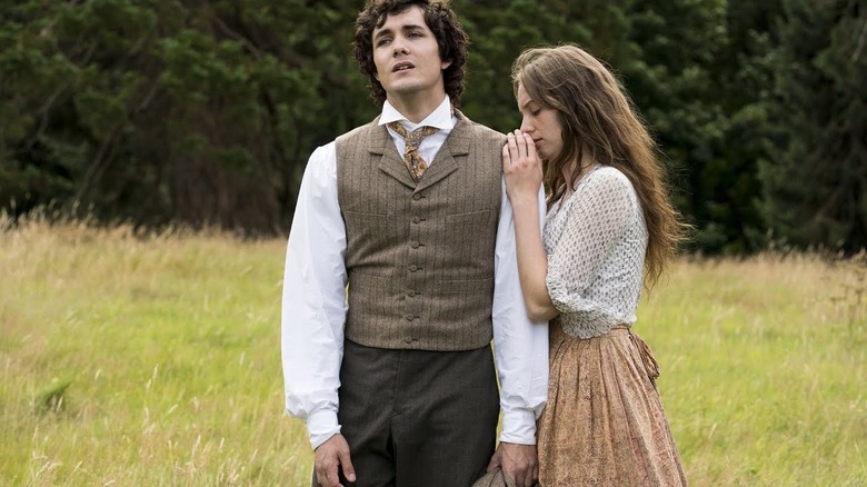 Jo March (Maya Hawke) embraces the shoulder of Laurie (Jonah Hauer-King) in Little Women (2017)