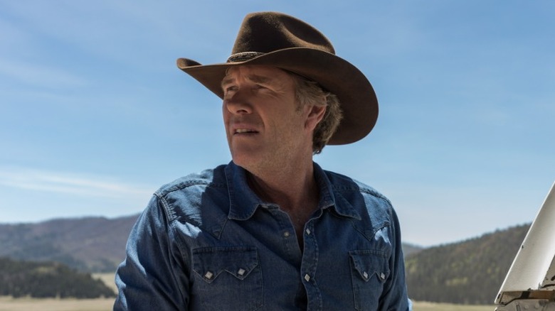 Sheriff Walt Longmire standing outside in a cowboy hat in Longmire Season 6