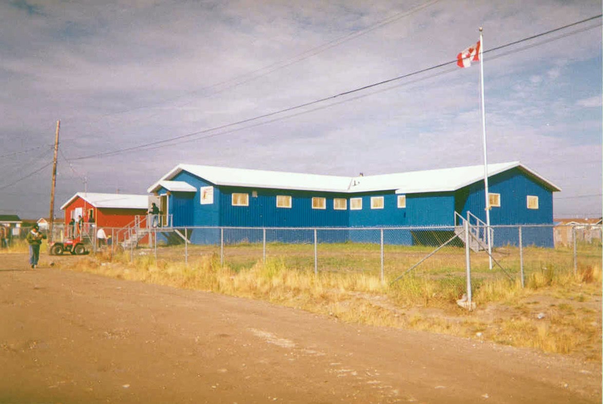 One red building and one blue building in the remote Attawapiskat First Nation