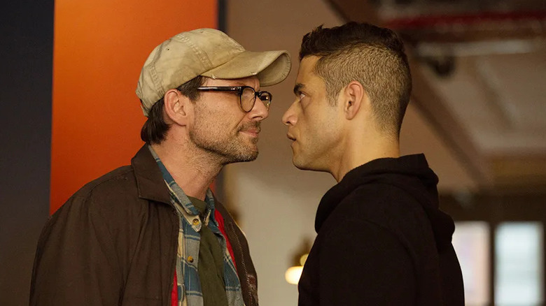 Christian Slater as Mr. Robot and Rami Malek as Elliot Alderson, confronting one another in Mr. Robot.