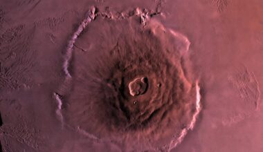 Olympus Mons stands nearly three times the height of Everest, yet standing at its base you would not see a mountain at all, because its slopes rise so gently across roughly 600 kilometres that the summit sits well beyond the Martian horizon and the ground at your feet looks almost flat