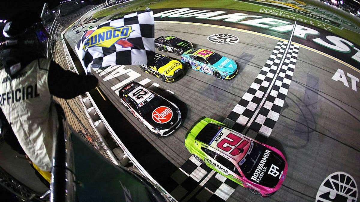 Ryan Blaney takes the checkered flag at EchoPark Speedway.
