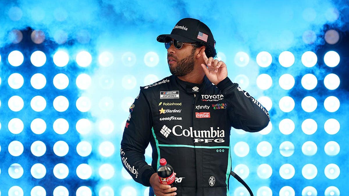 Bubba Wallace walks onstage during driver intros at EchoPark Speedway.