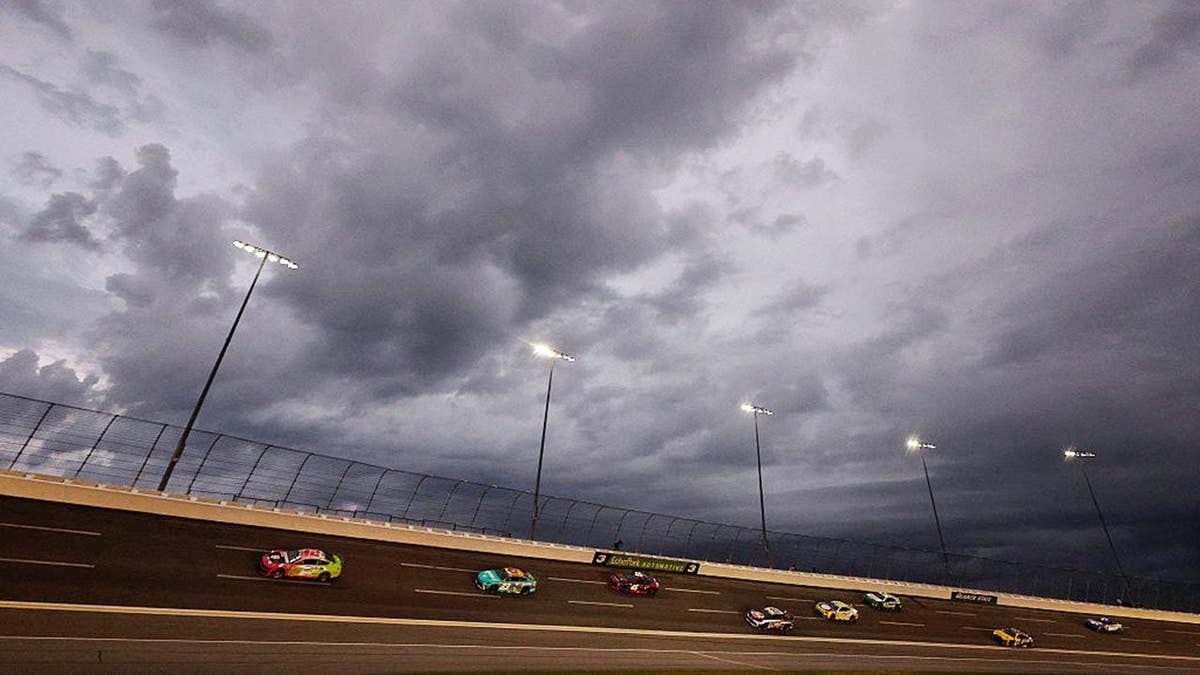 Racing cars circle EchoPark Speedway in Hampton, Georgia.