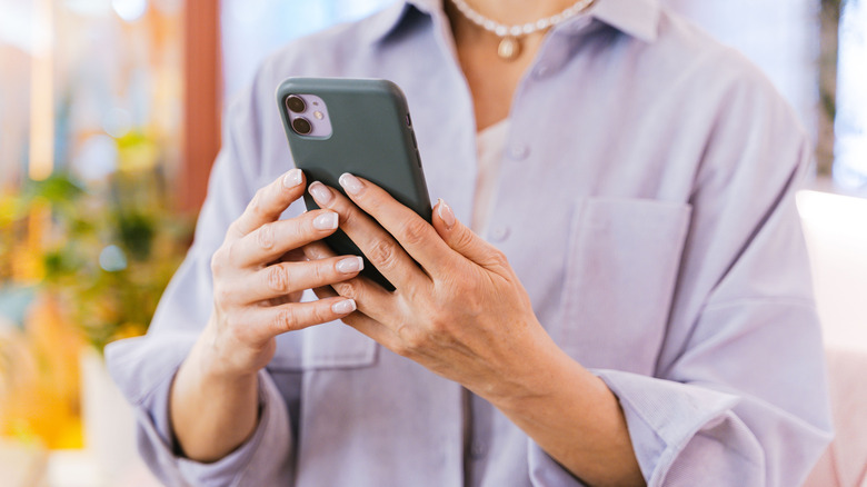 Woman using an iPhone
