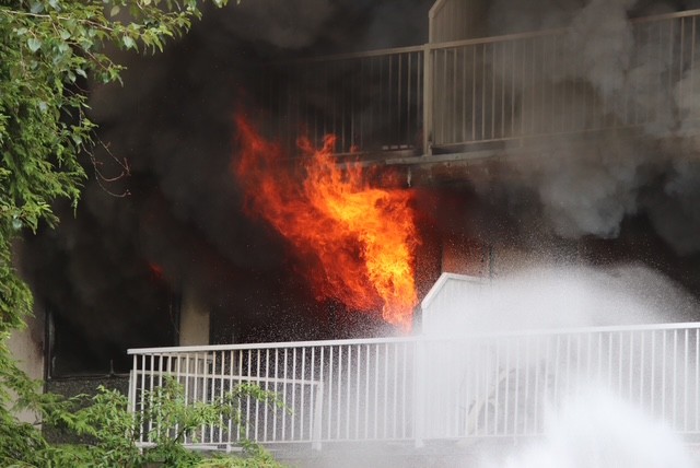 Apartment fire shuts down street in New Westminster