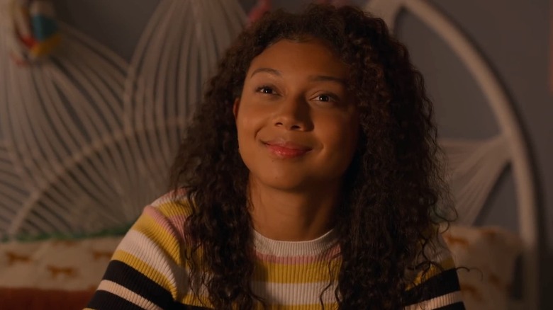 Monsé Finnie (Sierra Capri) smiles in her bedroom in On My Block