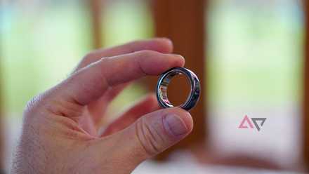 A person holding the Oura Ring 4 Ceramic