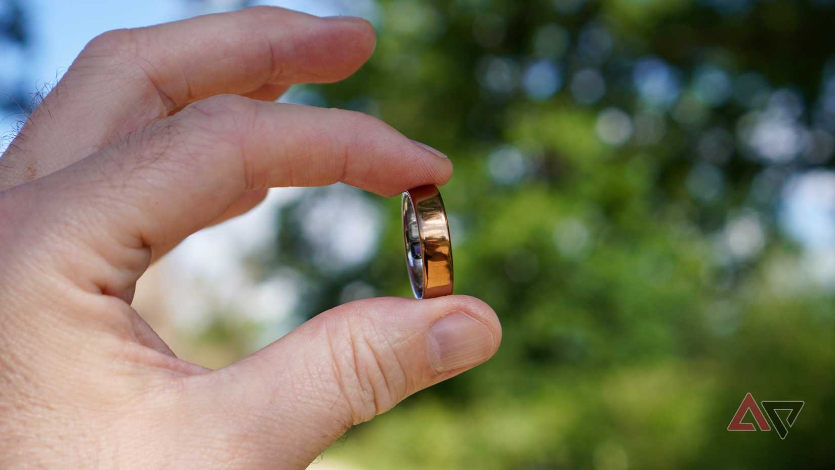 A person holding the Oura Ring 5