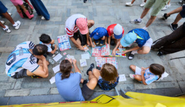 people exchanging stickers shot from above