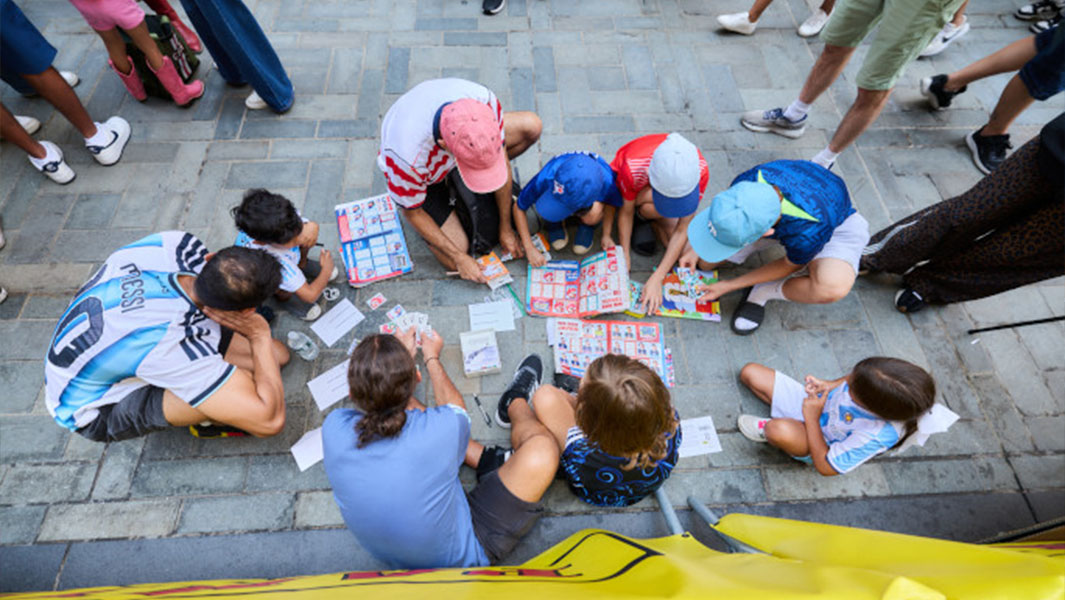 people exchanging stickers shot from above
