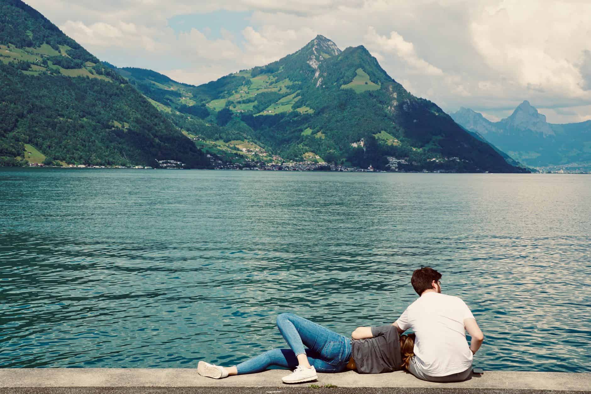 couple relaxing by lake