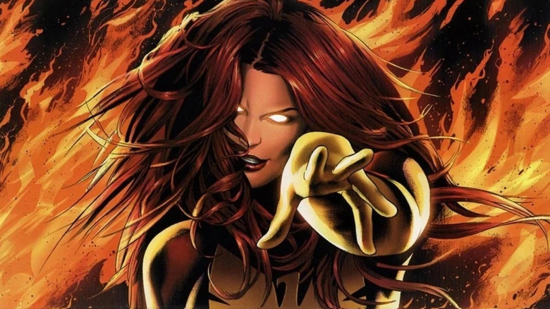 Phoenix points while wreathed in flames on the cover Phoenix: Endsong #1 artwork by Greg Land