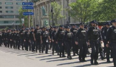 Police procession for fallen officer stops downtown Montreal in its tracks
