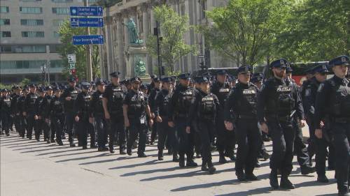 Police procession for fallen officer stops downtown Montreal in its tracks