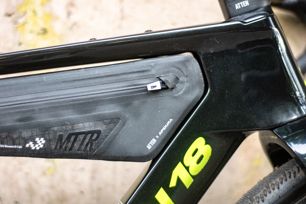 An Argon 18 Anti Matter gravel bike leaning against a concrete wall.